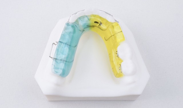 三角簧磨牙竖立器 